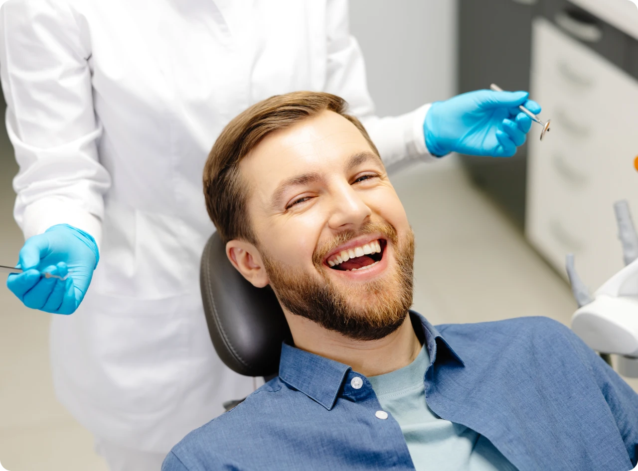Happy patient at dental clinic