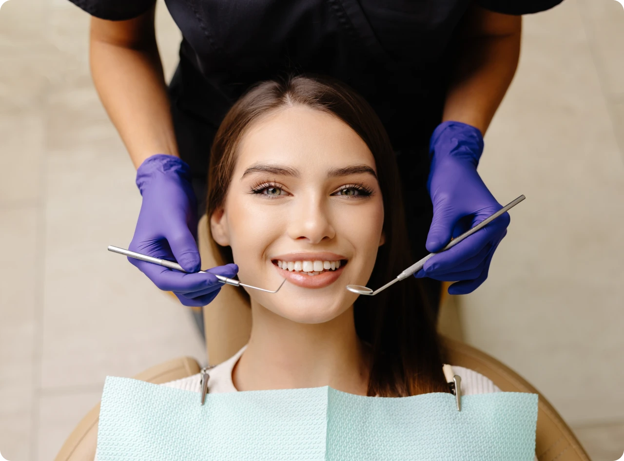 Dentist examining patient's teeth