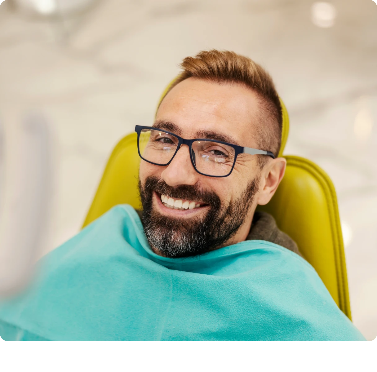 Man smiling in dentist chair