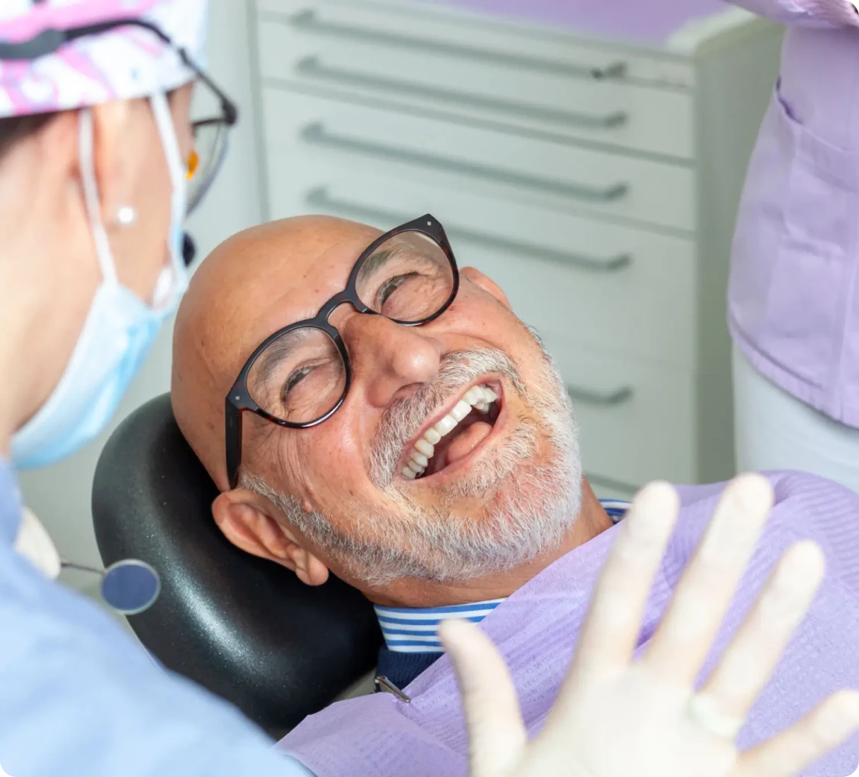 Dentist and patient sharing a laugh